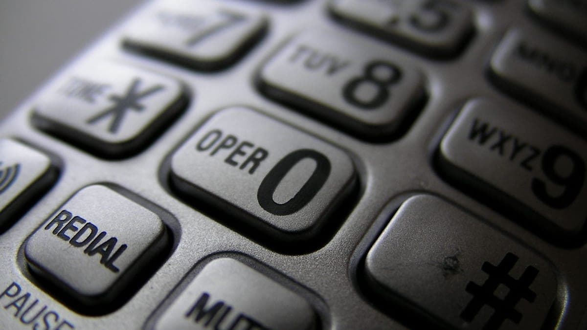 A corded home telephone with a numbered keypad
