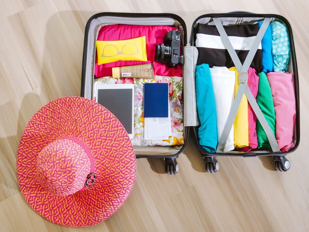 An open suitcase packed for a trip