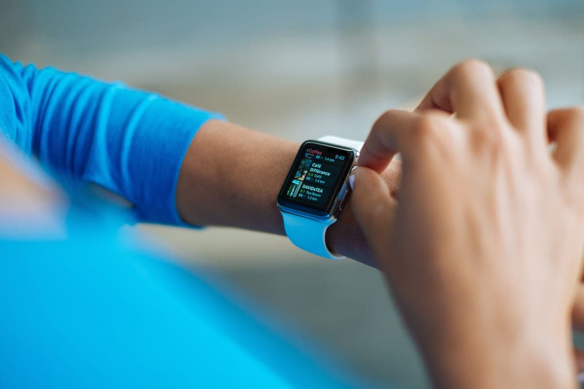 A smartwatch worn on a wrist showing a fitness screen